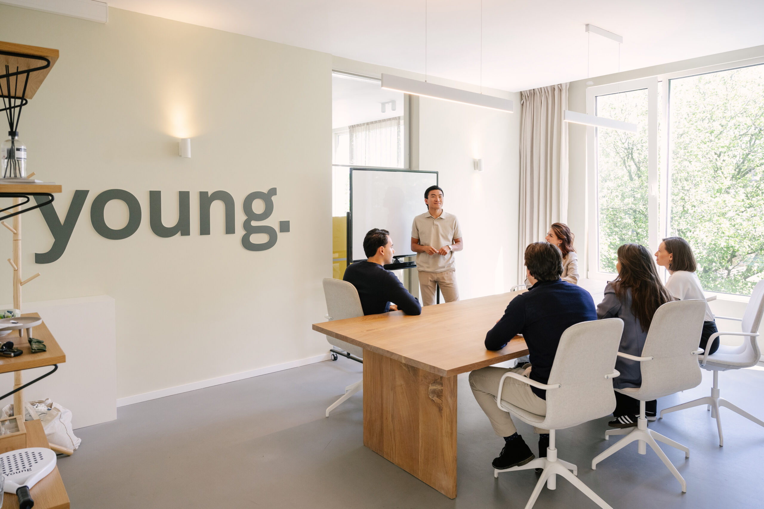 Team meeting at YOUNG office with modern design and collaborative workspace